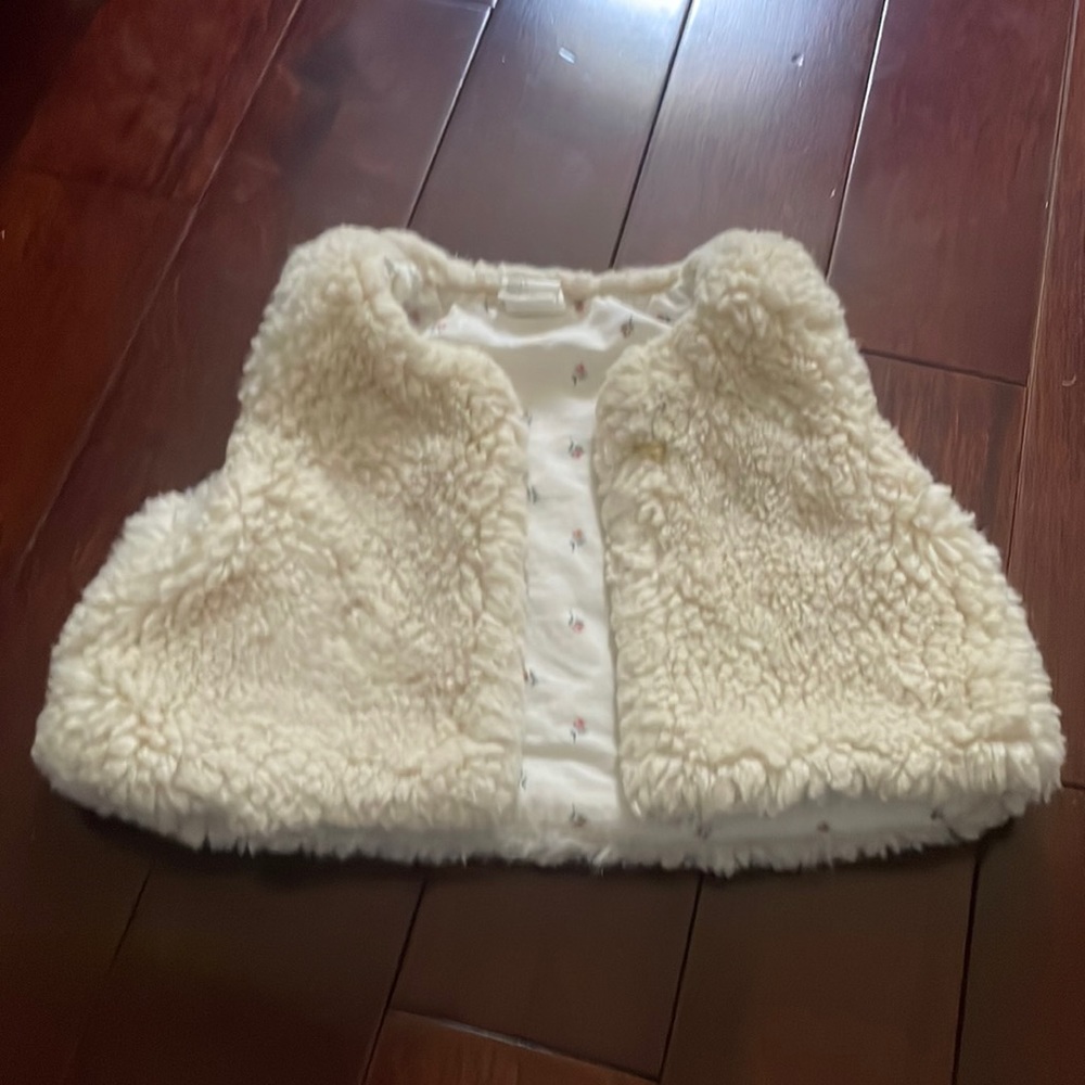 This is such a soft little vest for a cute little girl.